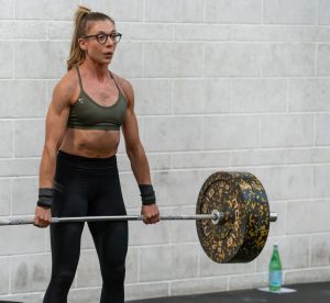White woman aged 30-35 weightlifting