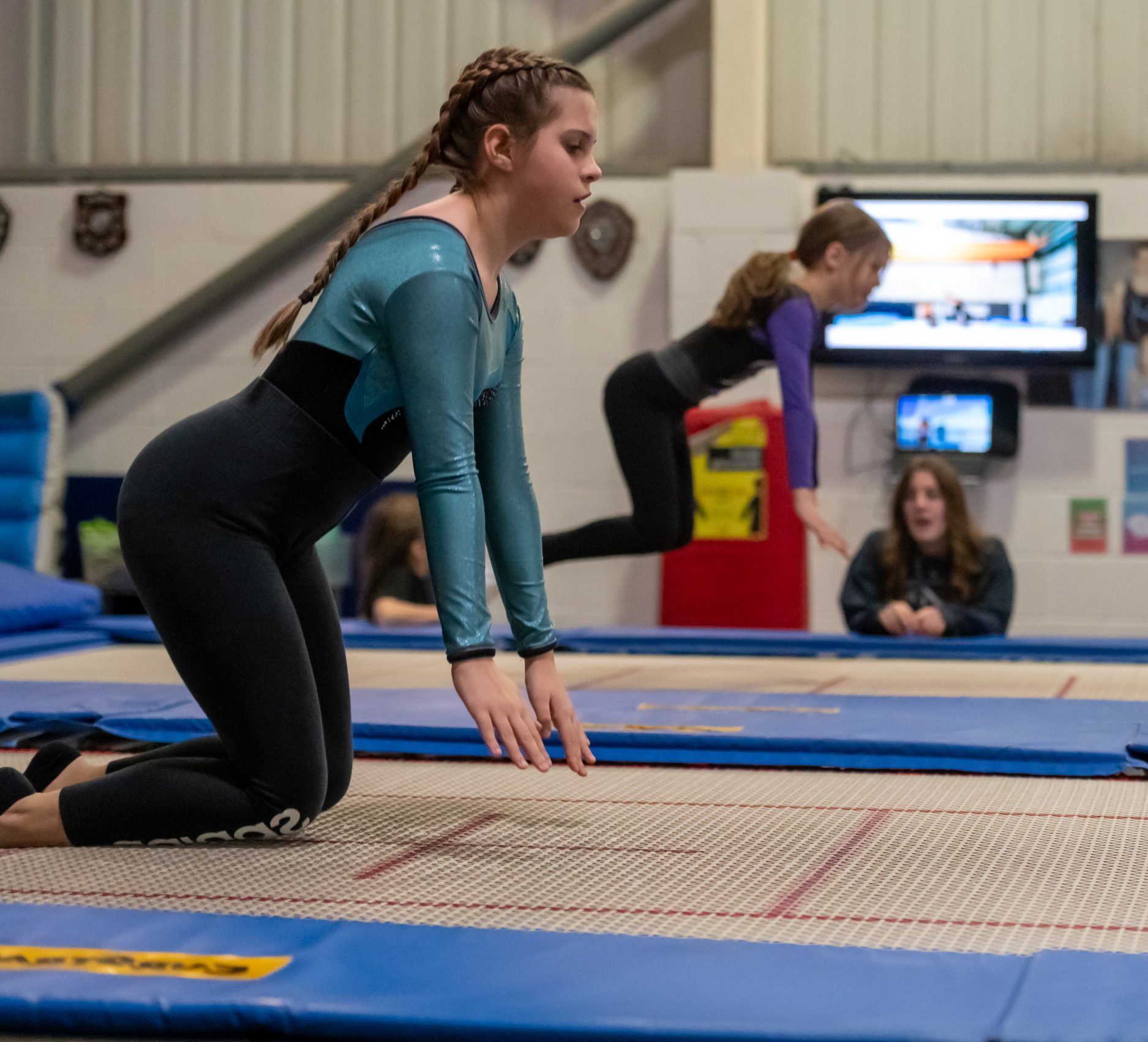 Young white woman aged 15-18 trampolining