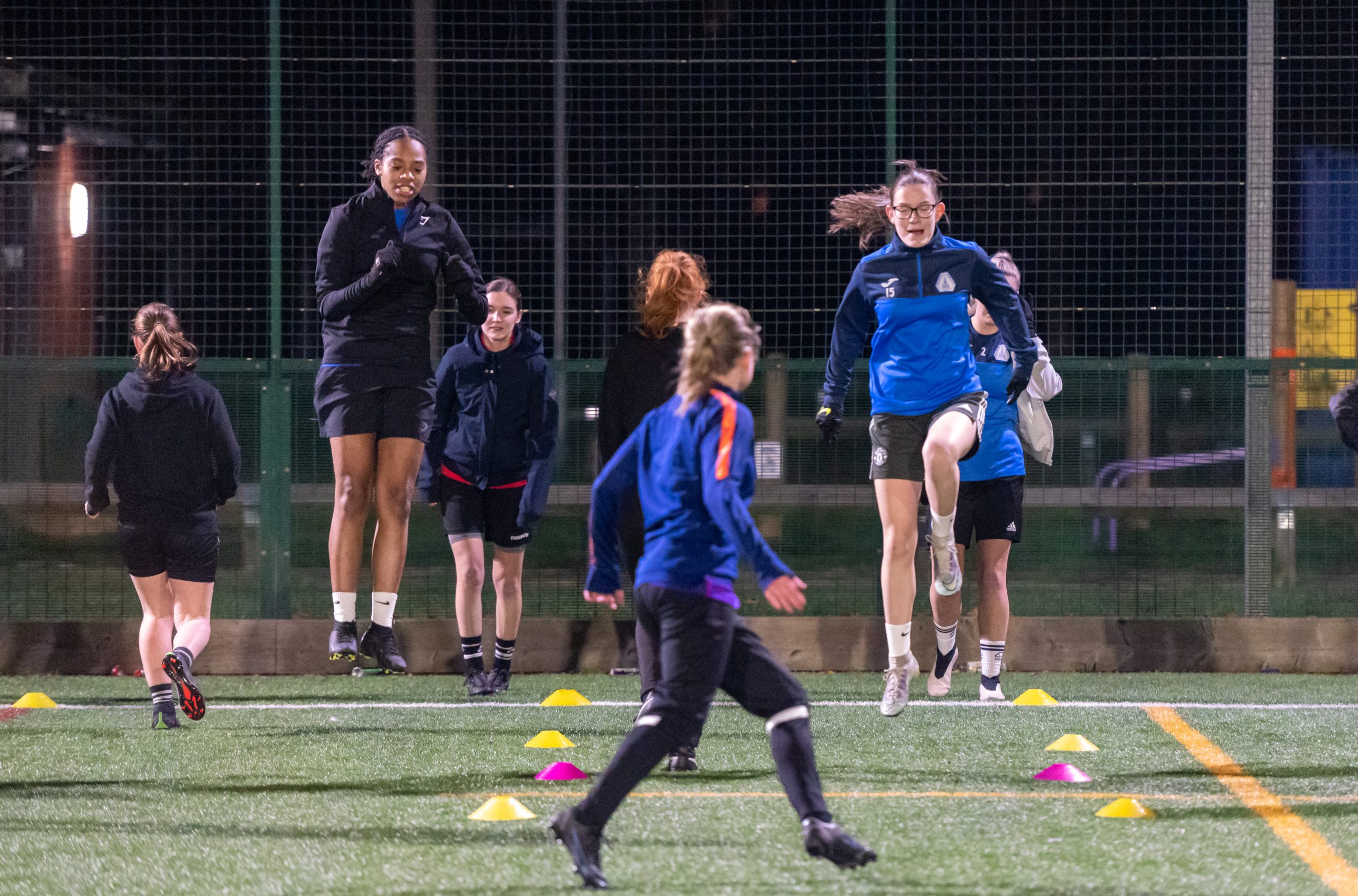 Women's football club training at night