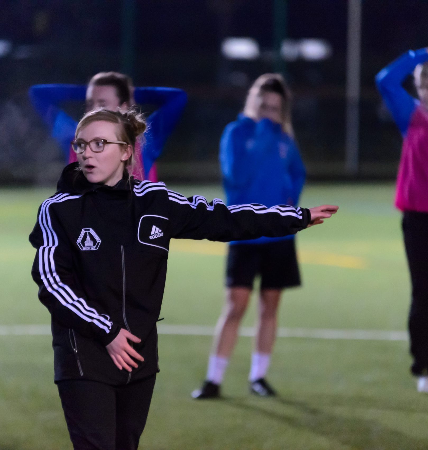 Woman coaching a football session