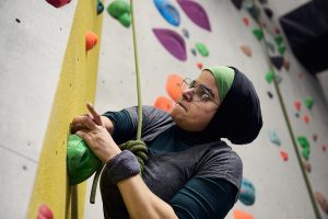 A Muslim para climber with an amputated arm
