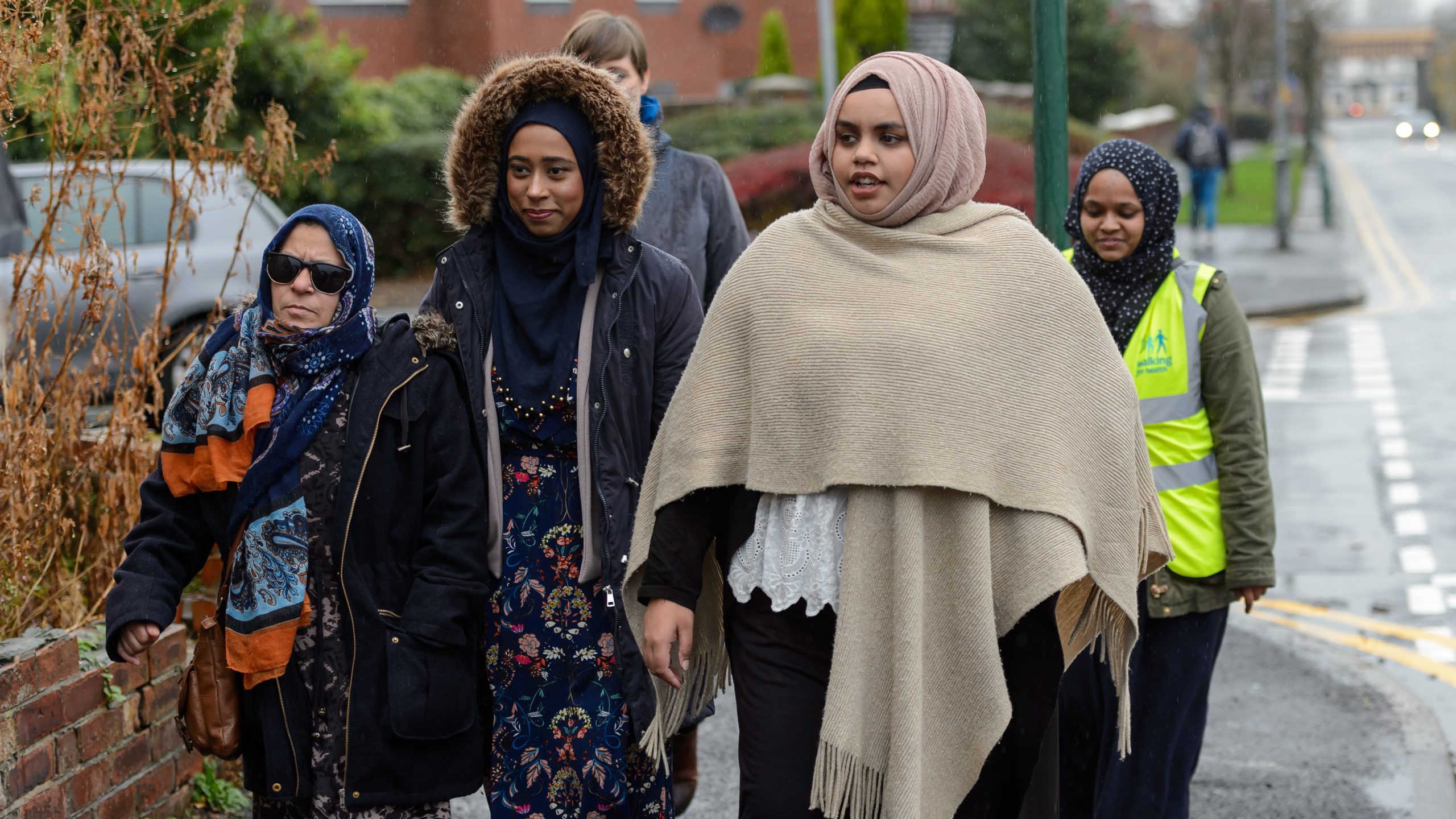 A group of Muslim women walking as part of a group activity