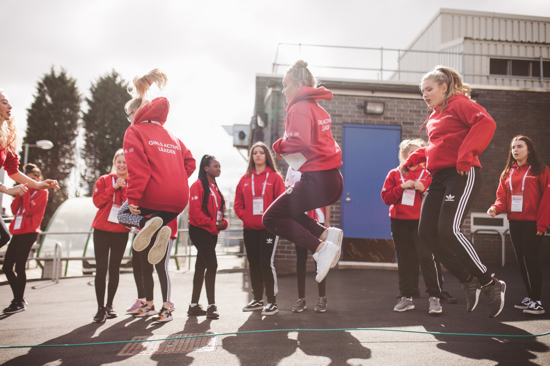 A group of school girls warming up for PE