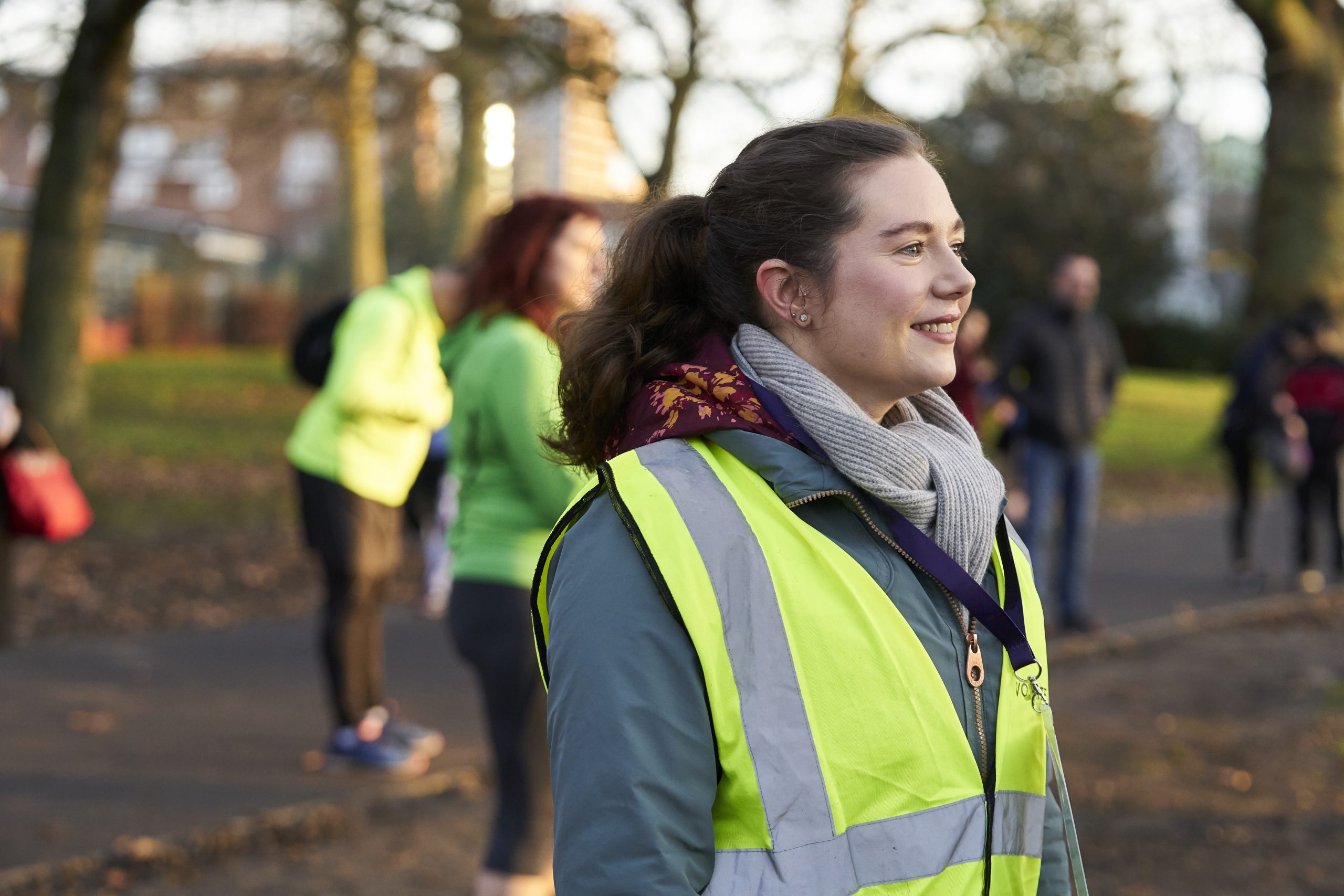 Woman in high vis jacket coaching