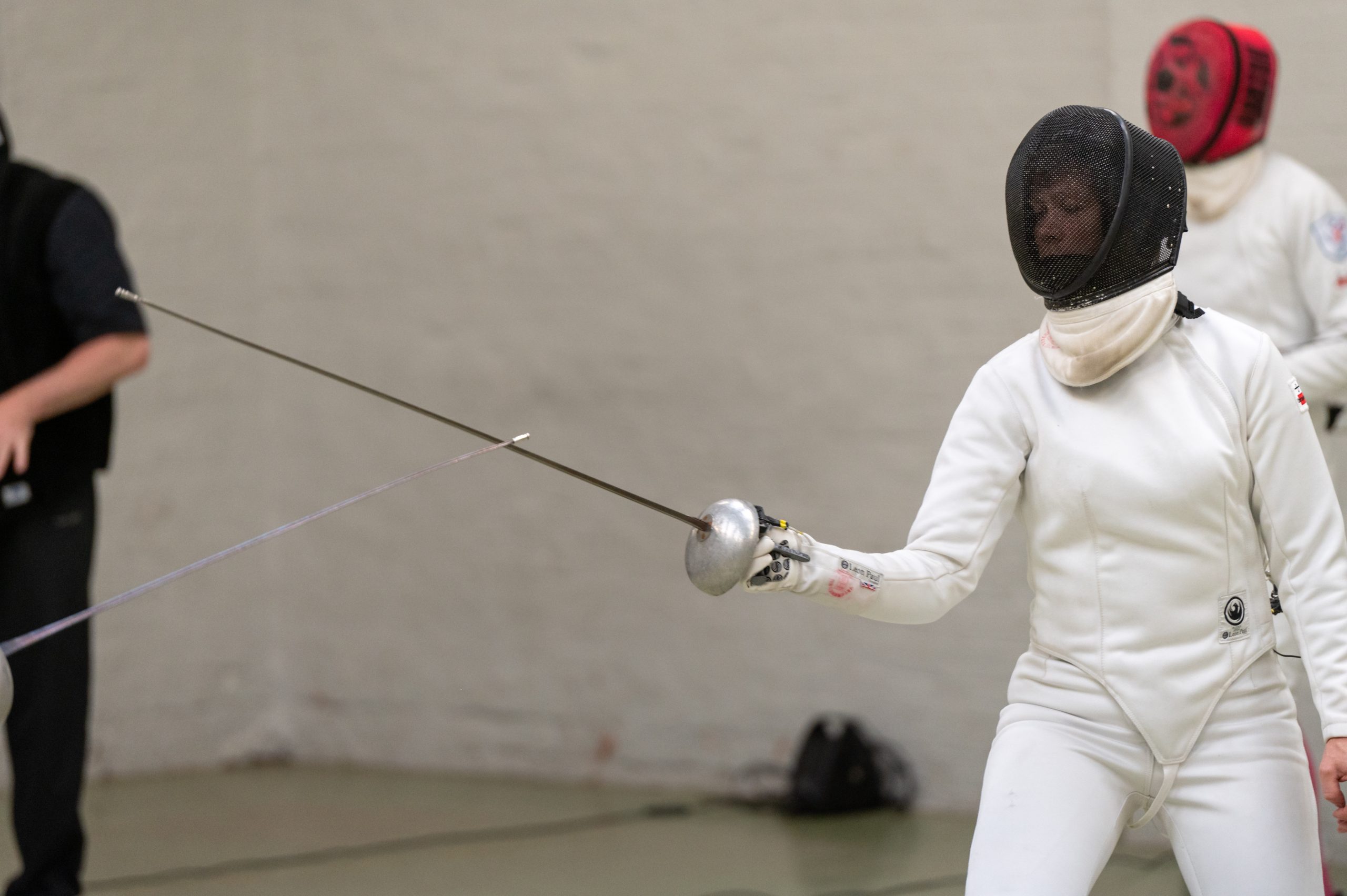 White woman aged 30 to 40 fencing