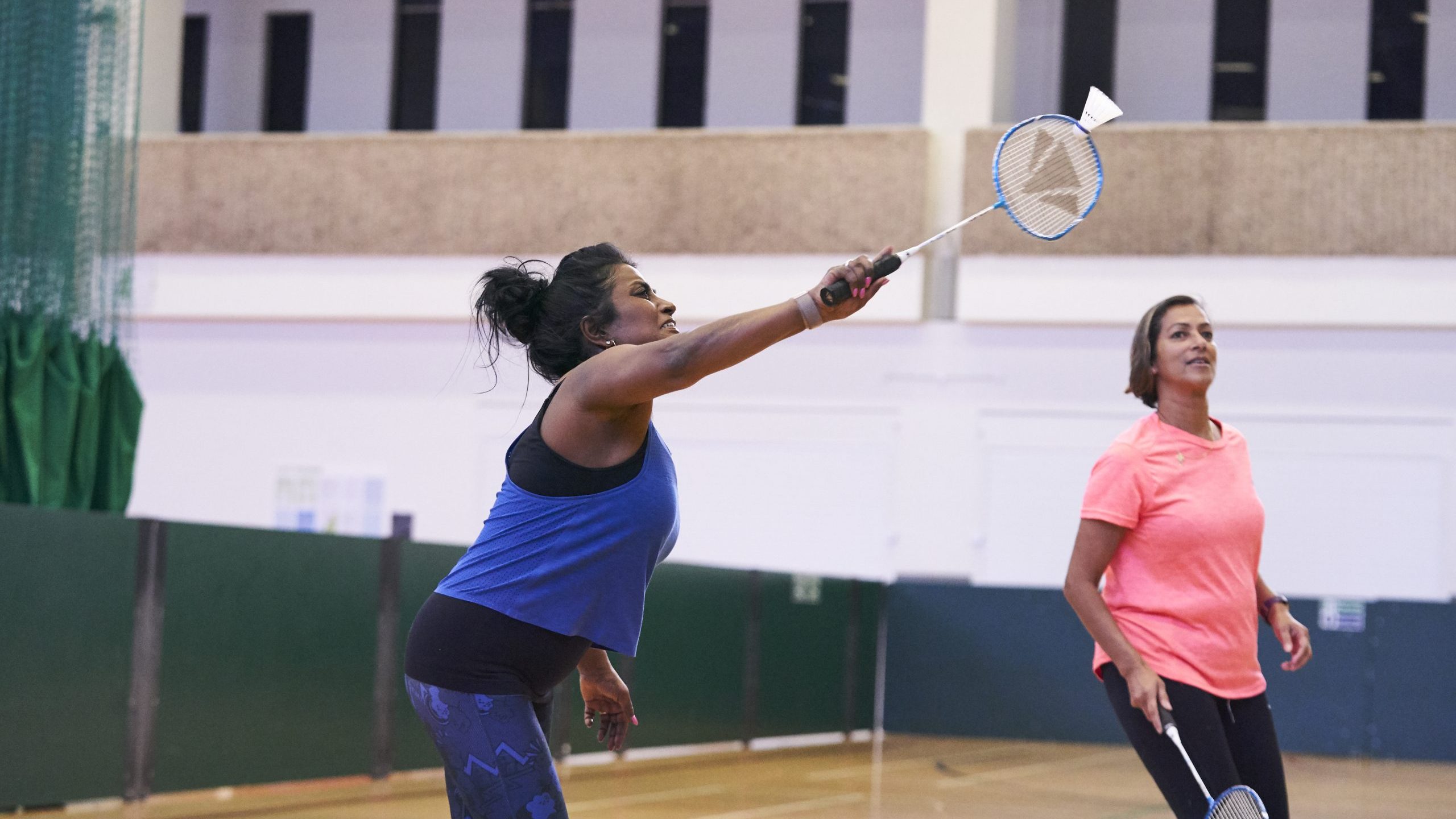Two south Asian women playing badminton