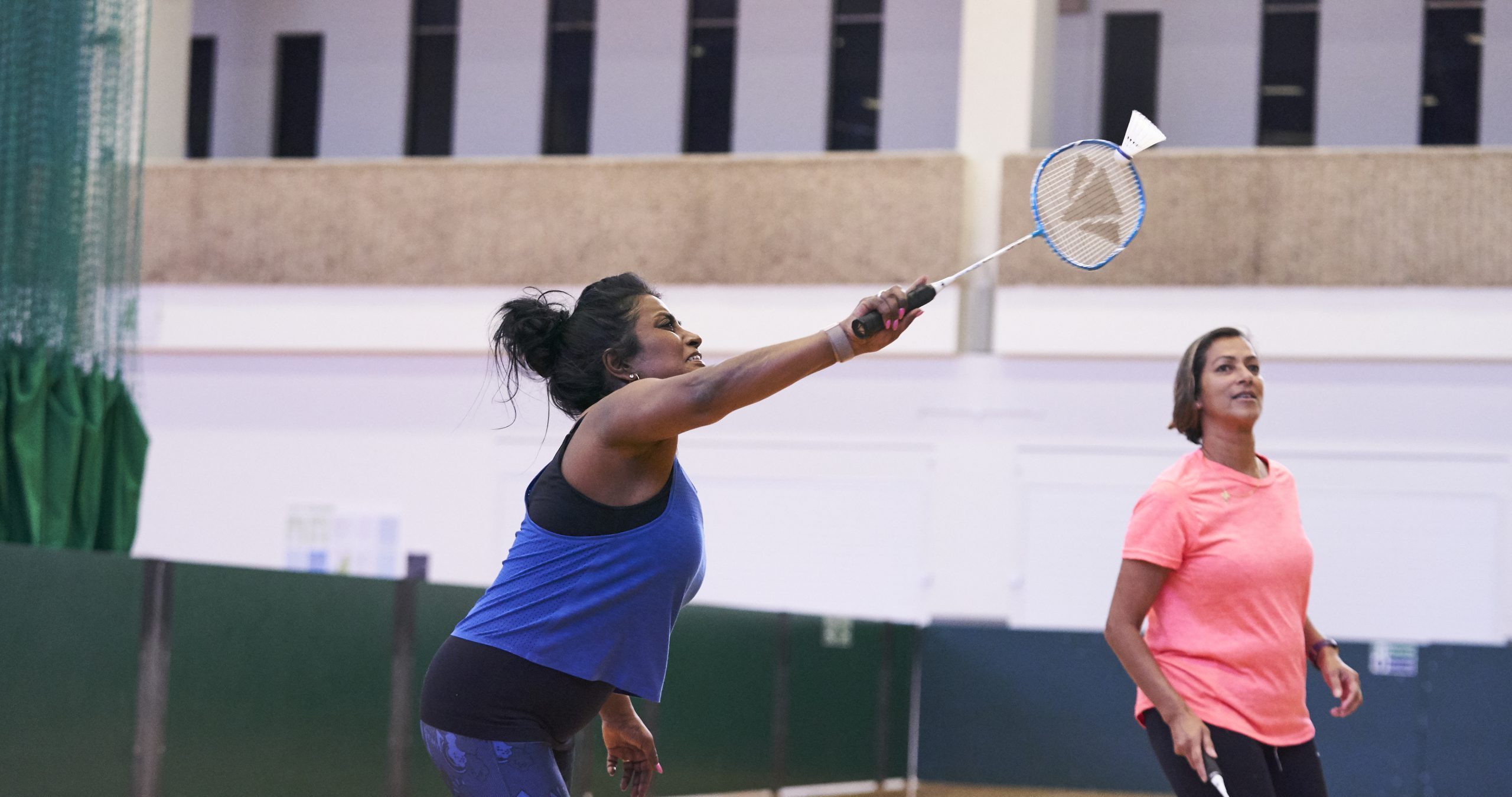 Two south Asian women playing badminton
