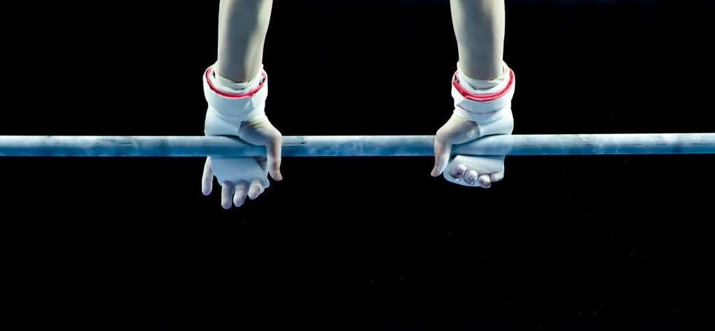 Hands on a gymnastics bar