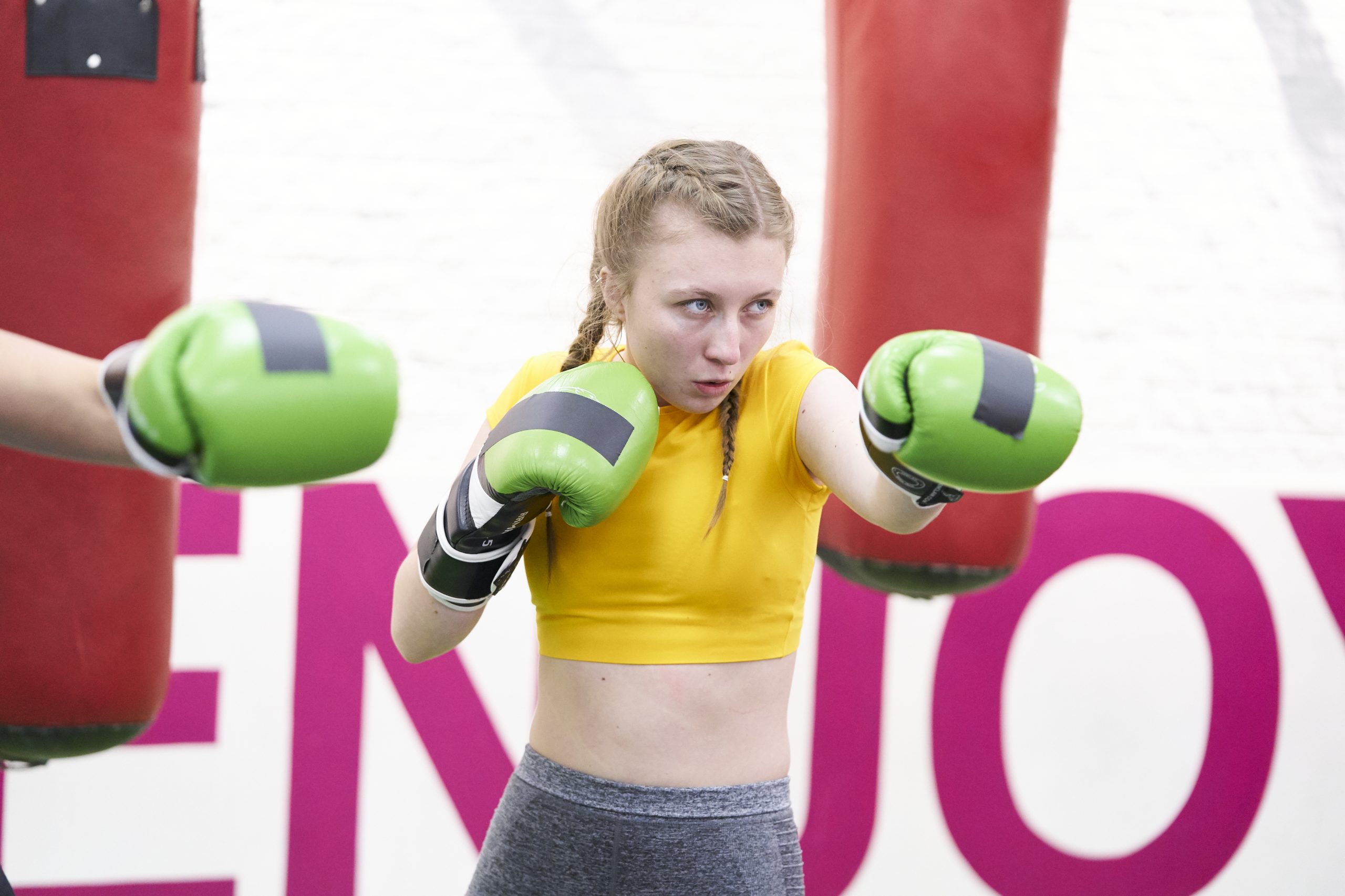 A white teenage girl boxing