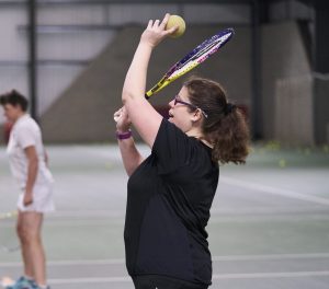 Disabled woman playing tennis