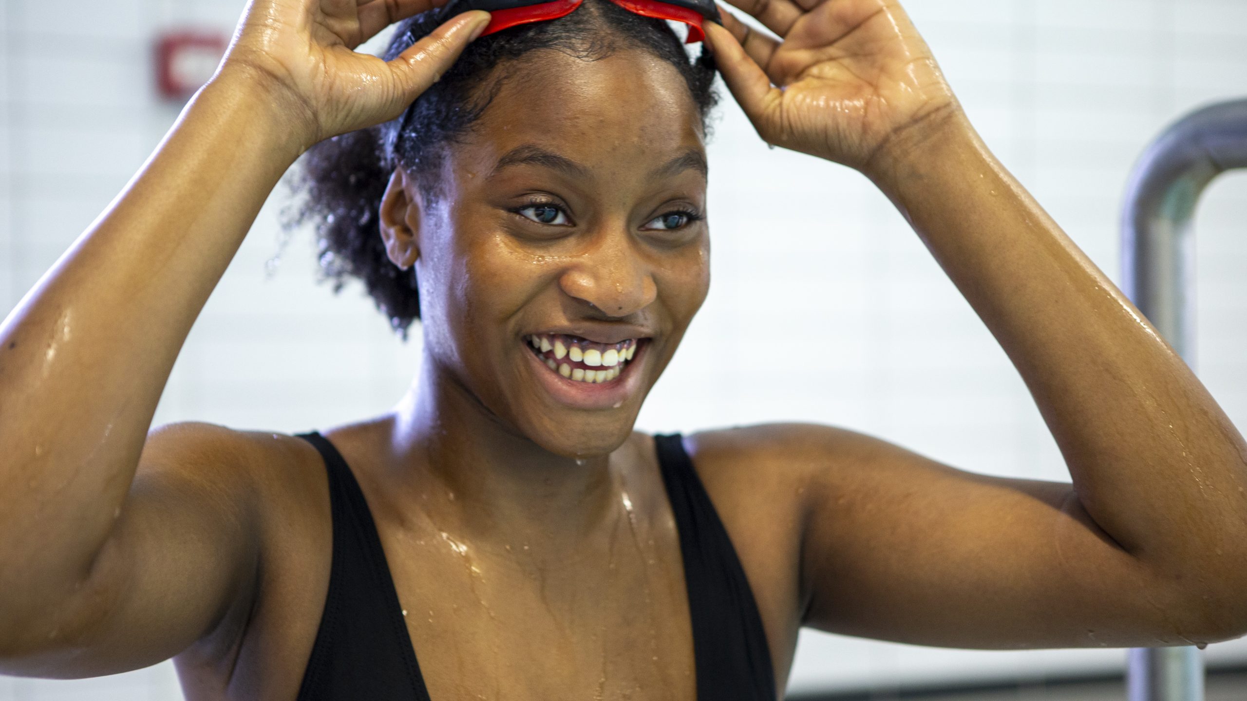 A black teenage girl swimming