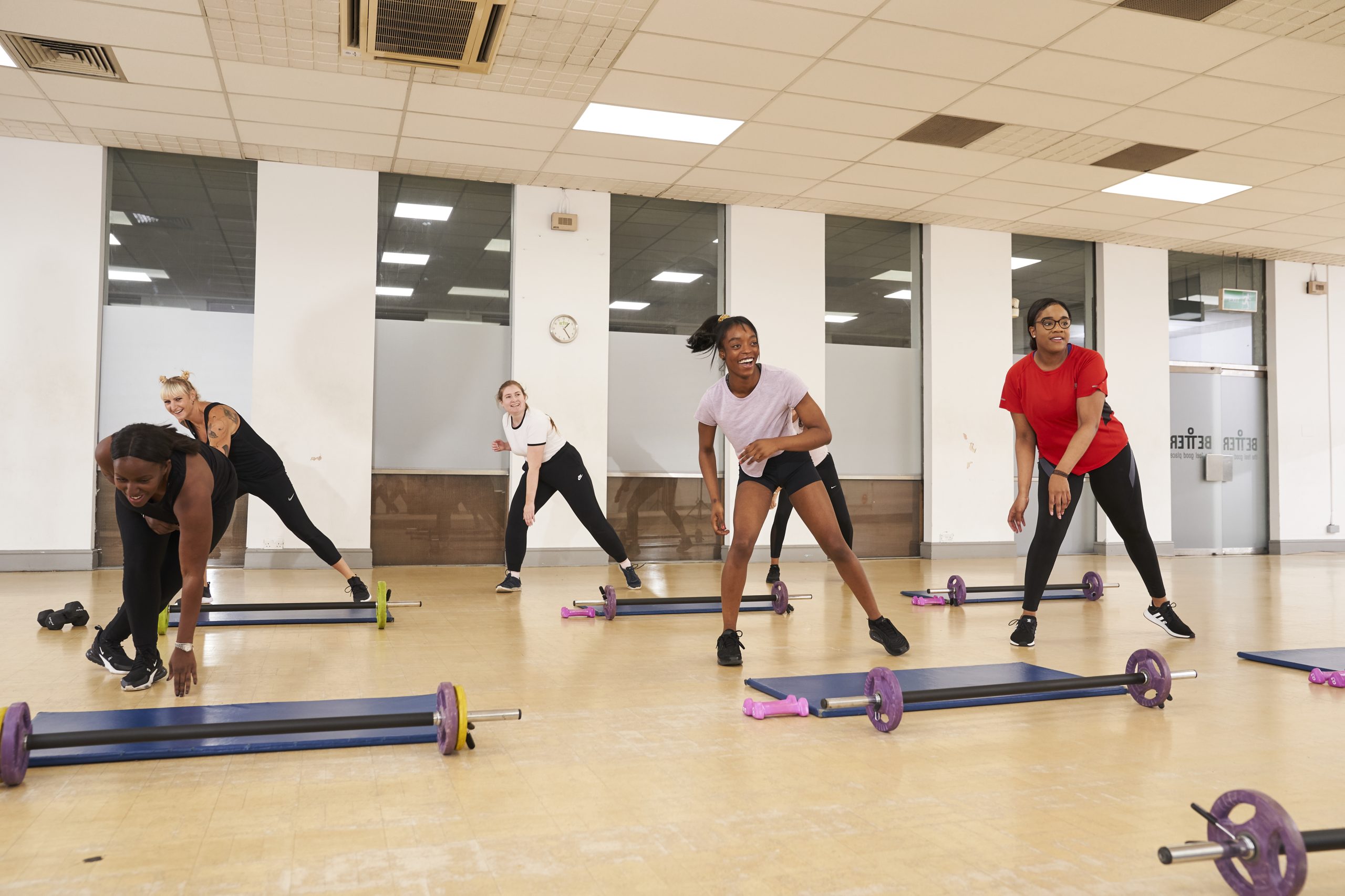 A group of women exercising in a leisure centre hall