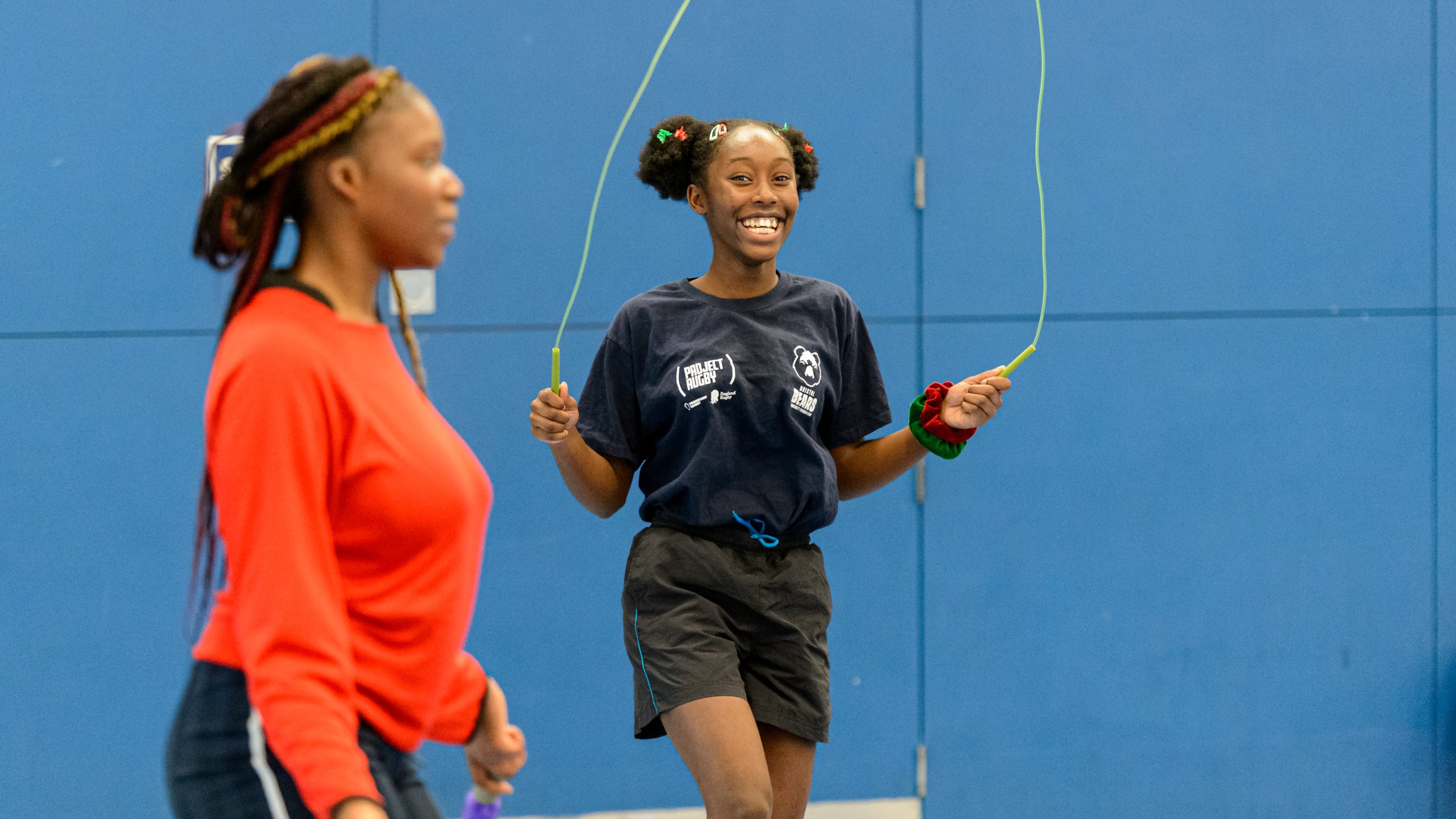 A young black teenager skipping rope