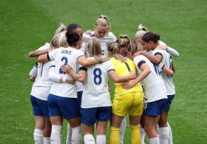 The England Lionesses in a team huddle