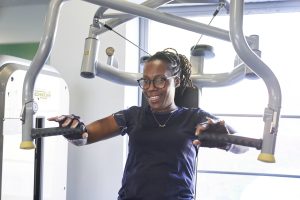 A black woman with braided hair at the gym