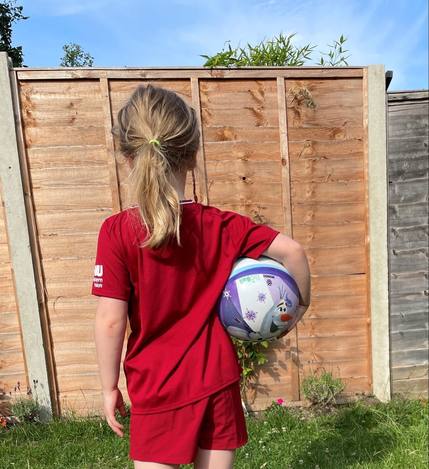 Emily's daughter in her football kit