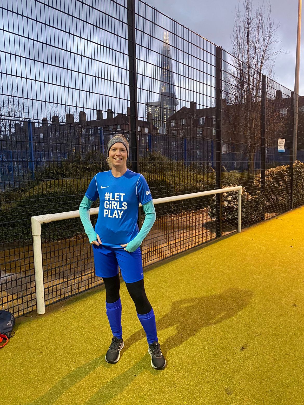 Emily Robinson at football wearing a shirt that says 'Let girls play'