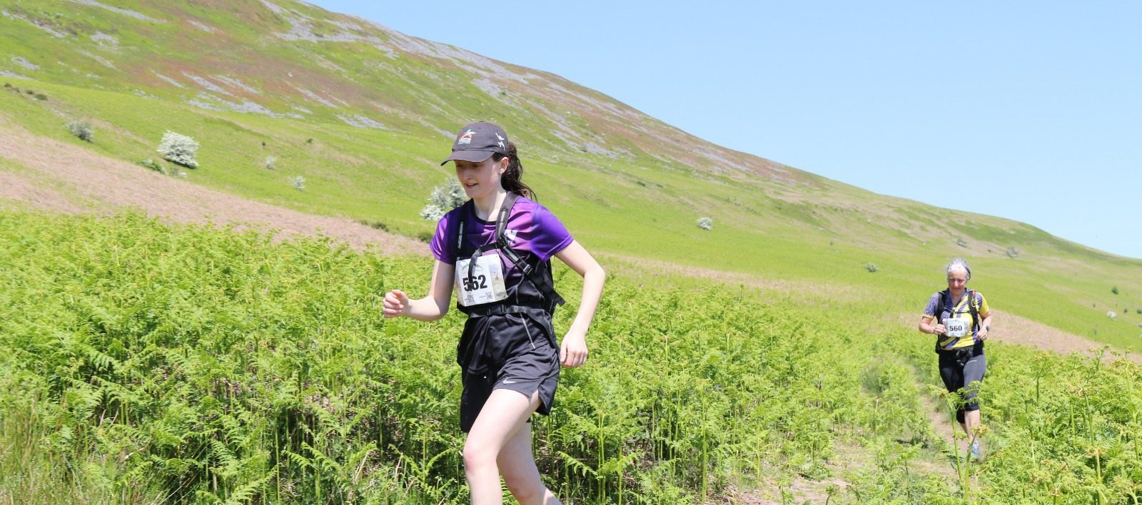 Young woman running a half marathon to fundraise for women in sport charity