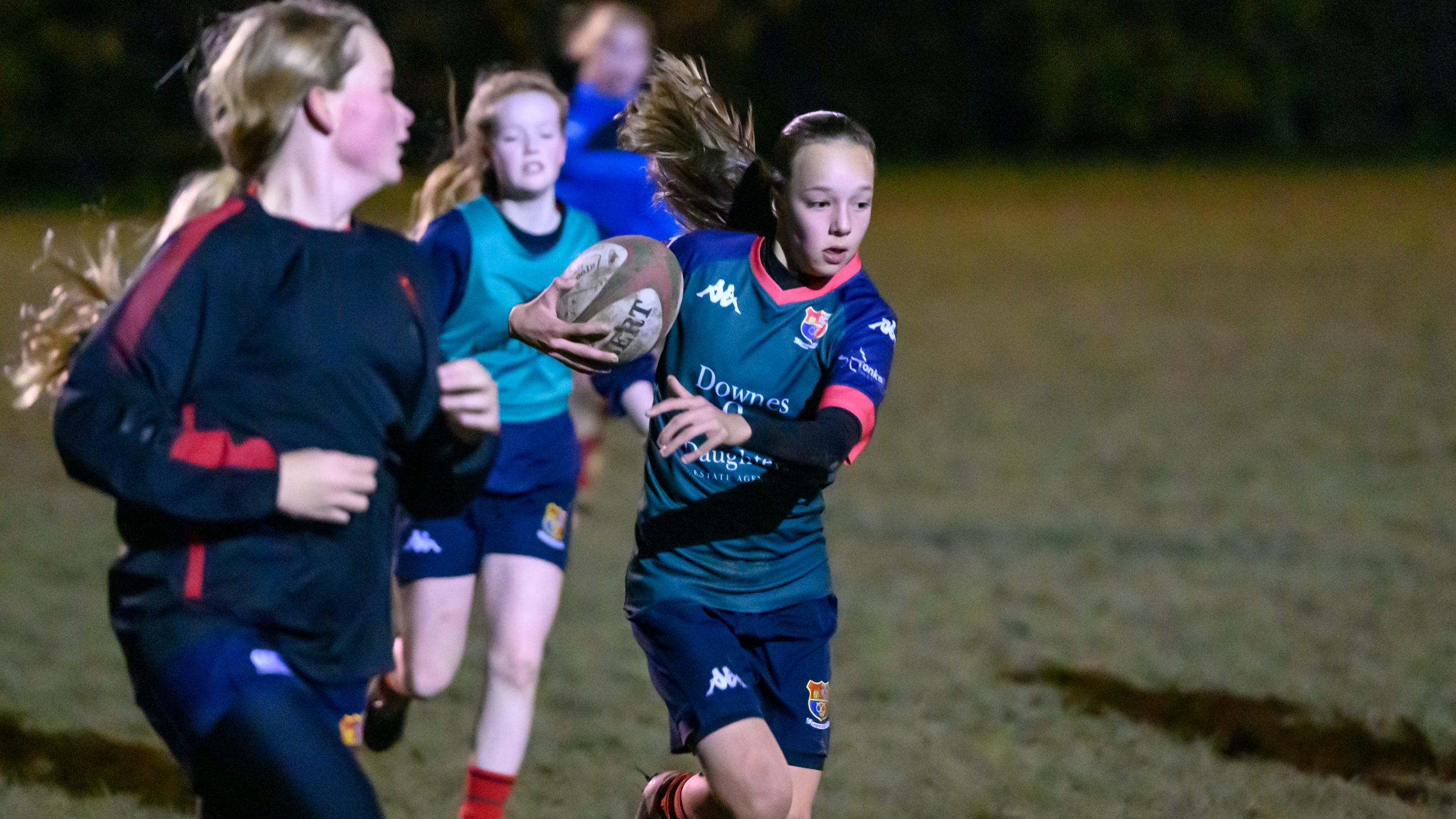 Girls playing rugby