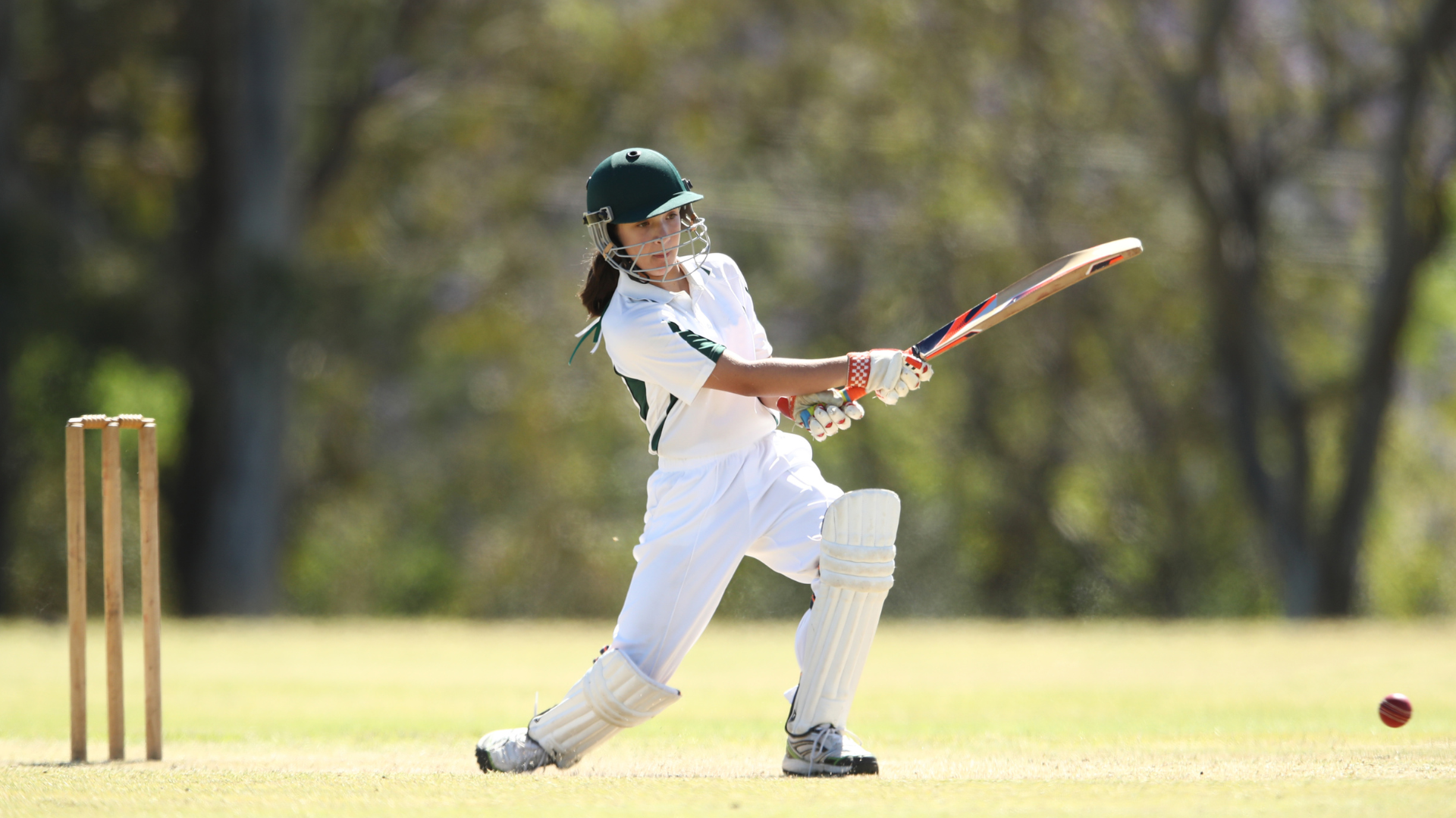 White woman playing cricket
