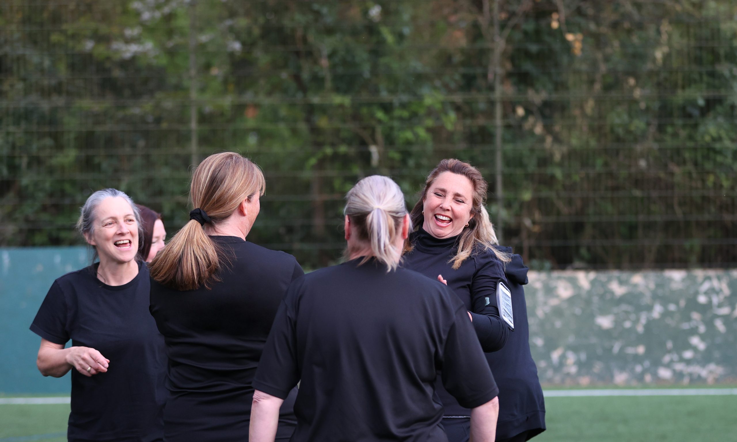 Women playing football together