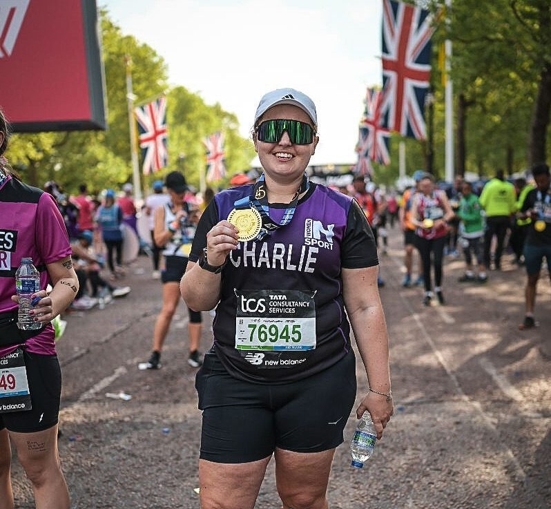 Charlie after completing the London Marathon 2025, wearing her medal and smiling