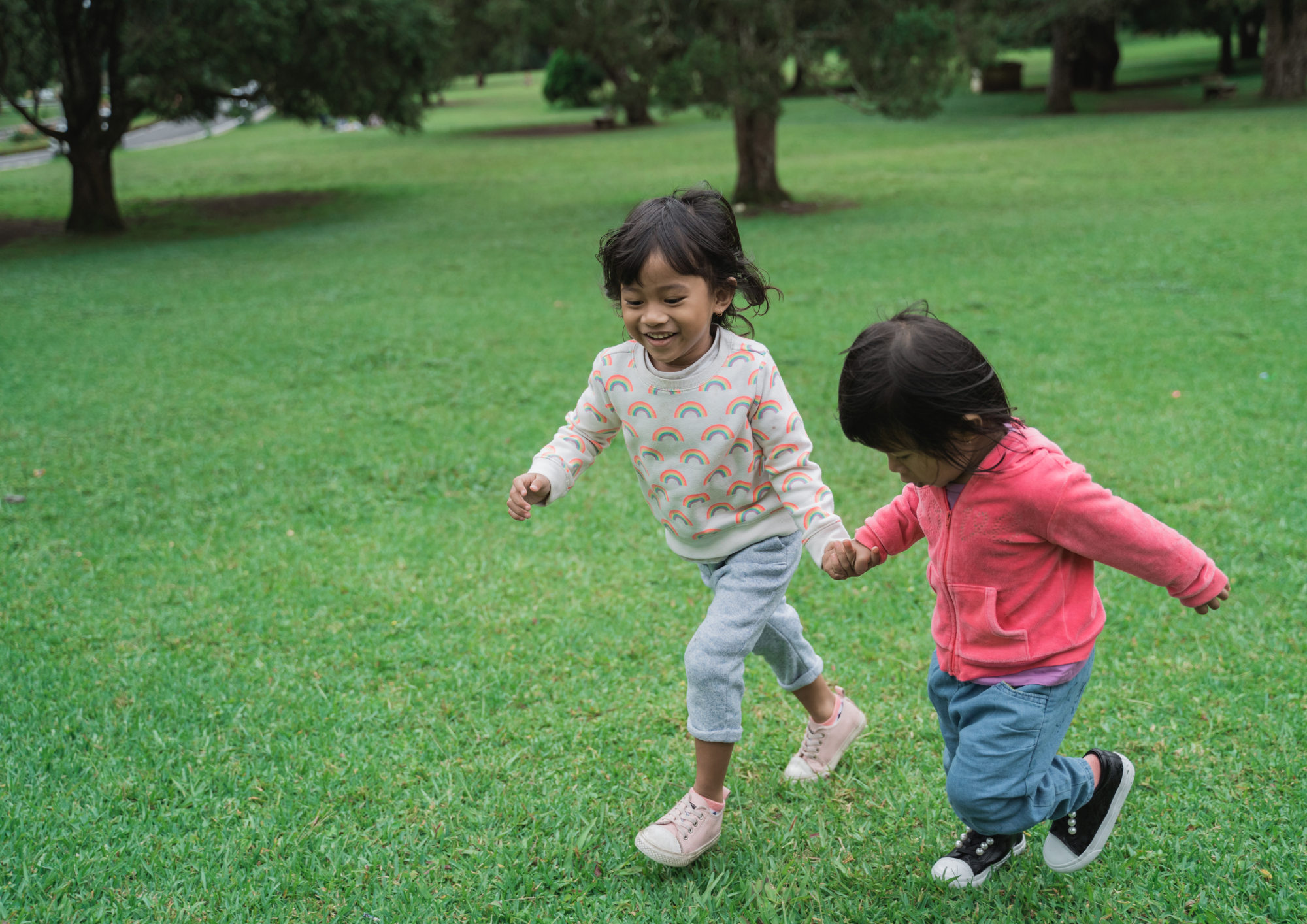 Two sisters playing in their local park