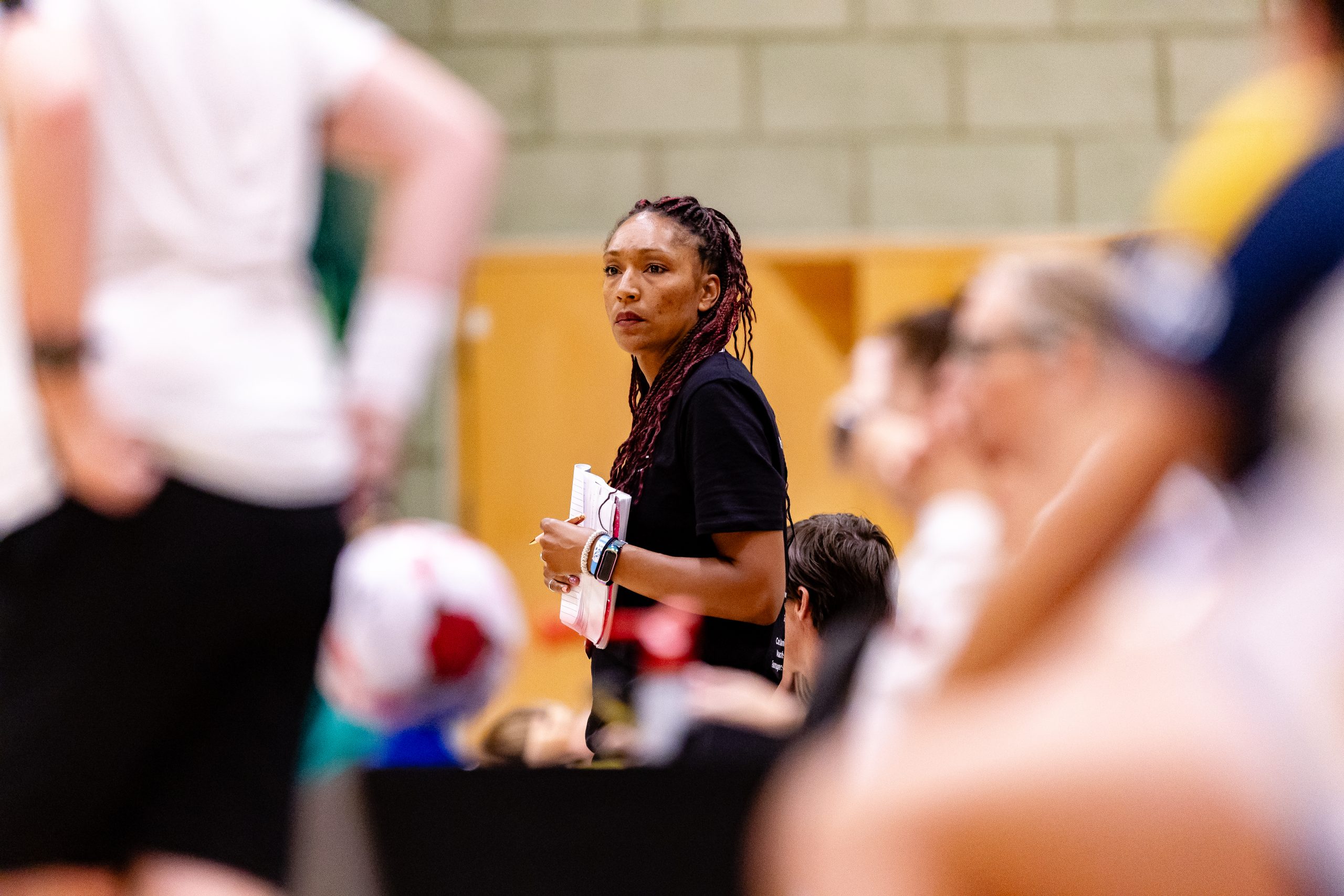 Mixed race female netball coach. Photo credit: England Netball