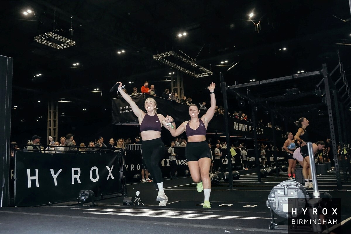 Laura Turner taking part in a Hyrox event with her sight guide